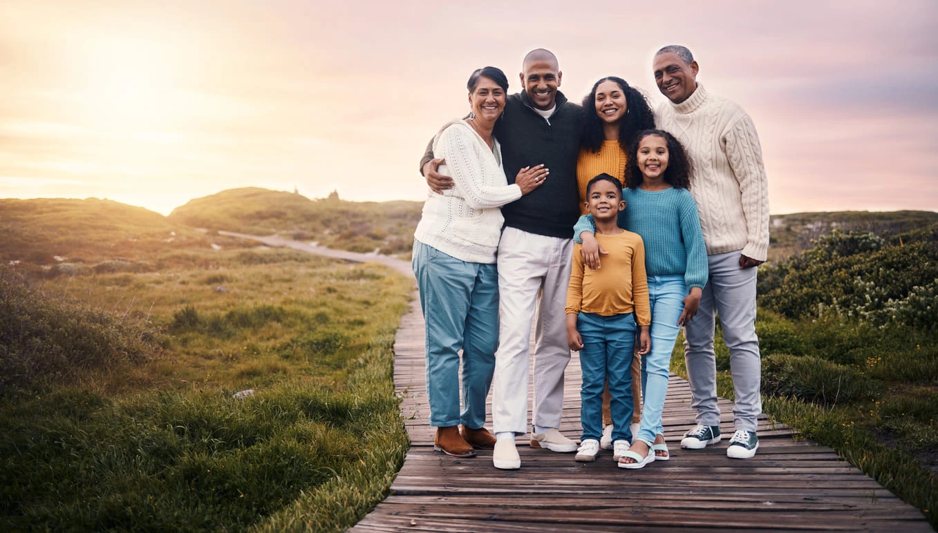 Happy multigenerational family enjoying the outdoors, symbolizing the importance of family unity in Illinois family law, supported by Park Gold Group, serving clients throughout Chicago and surrounding areas