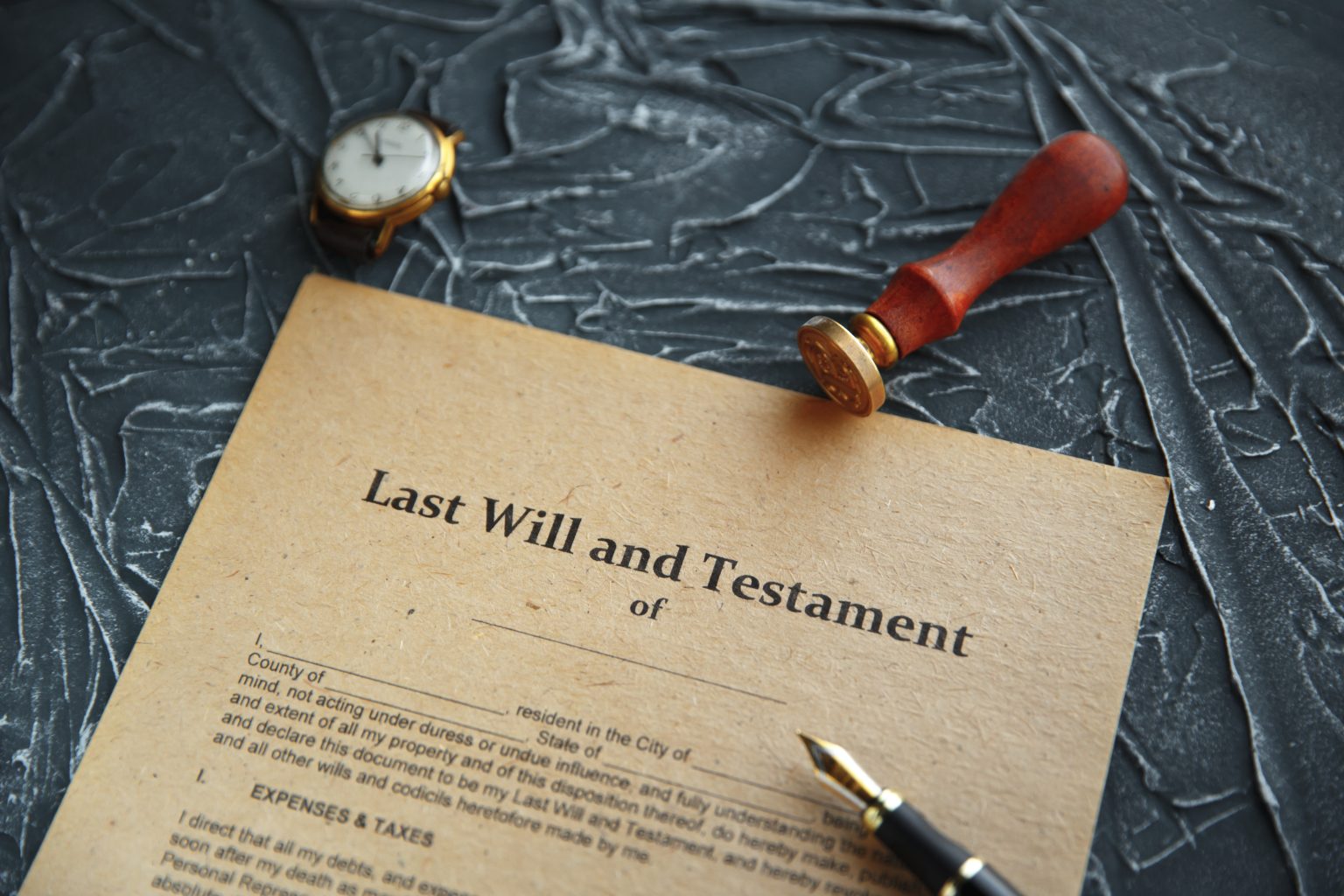 Notary's public pen and stamp on testament and last will. Notary public tools